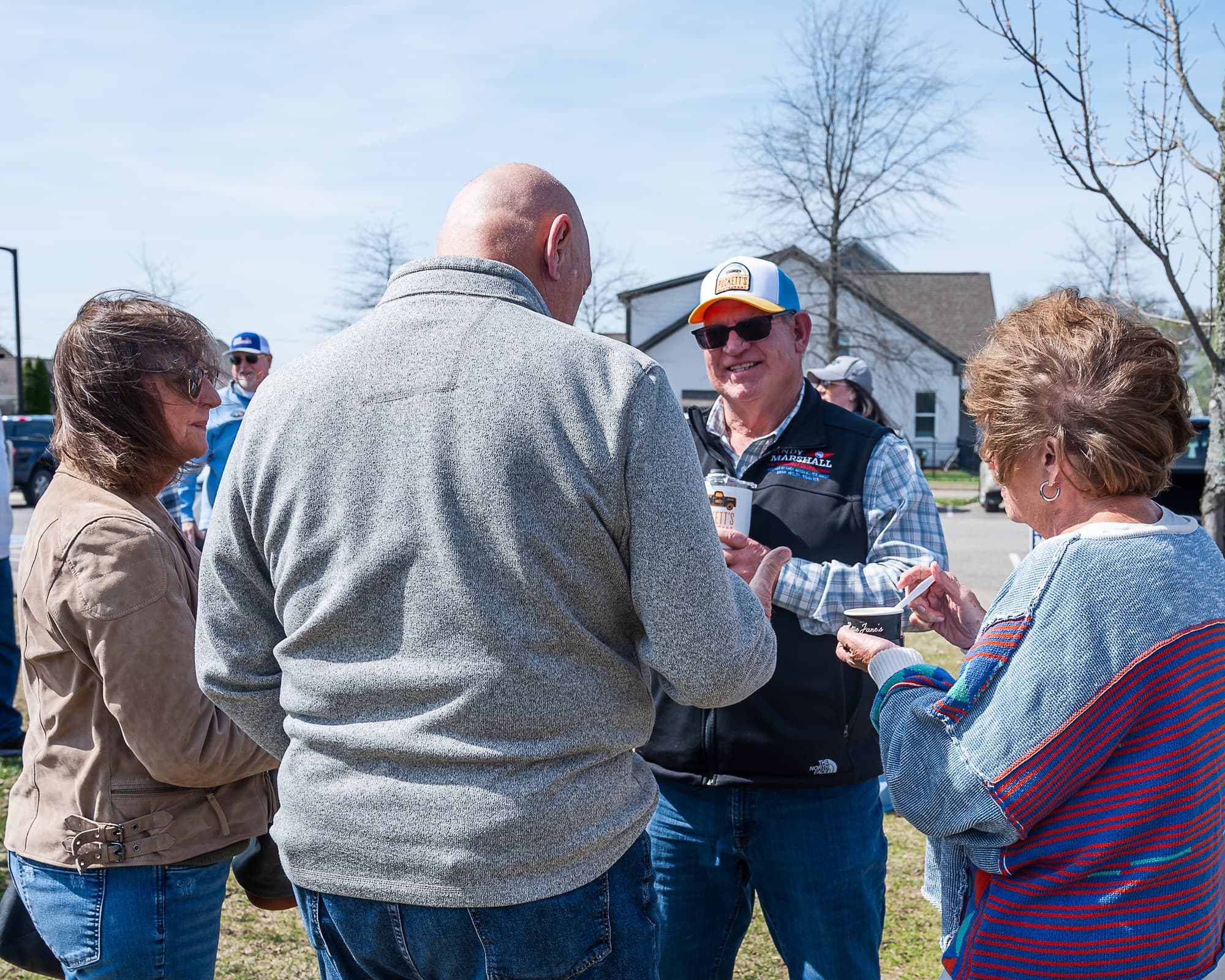 Andy Marshall talking with supporters at a community event